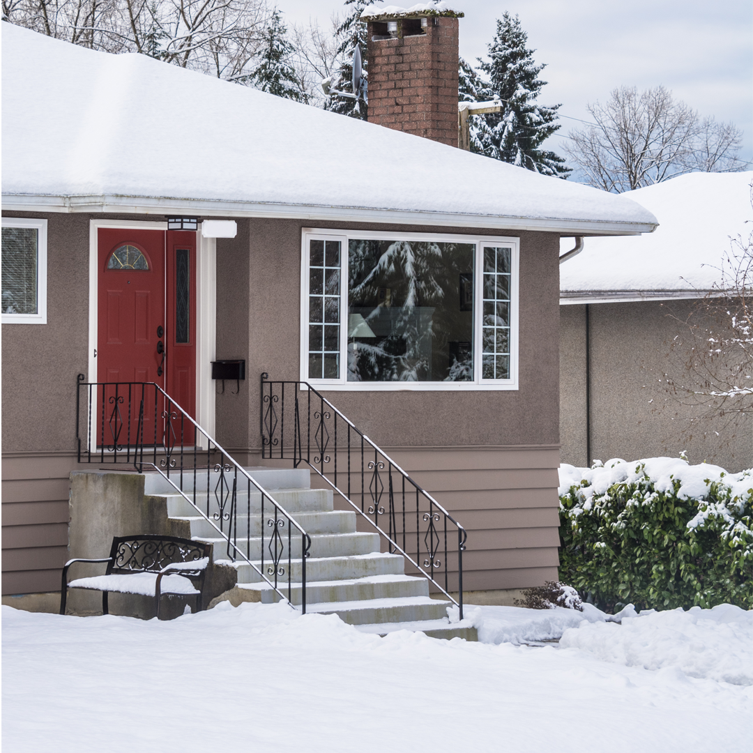 Plumbing-Issues-Snow-covered-homes-in-Forest-City-North-Carolina Snow-covered homes in Forest City North Carolina after January 2026 winter storm with ice on trees and power lines