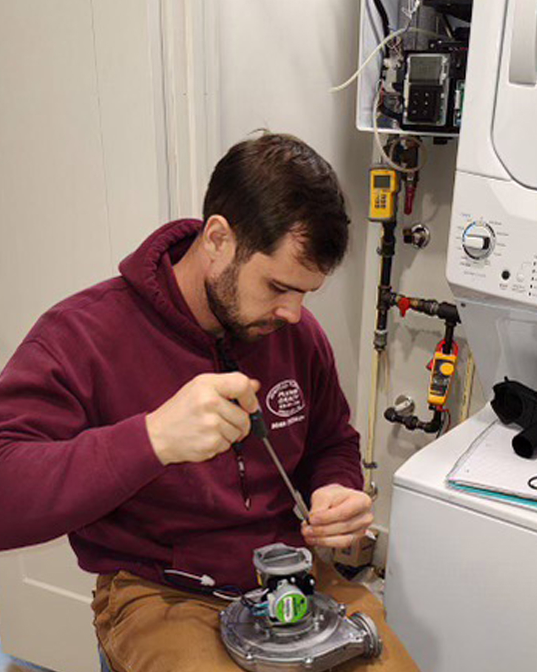 Ohmstead Plumbing technician delivering a new Rheem water heater for installation near Shelby NC